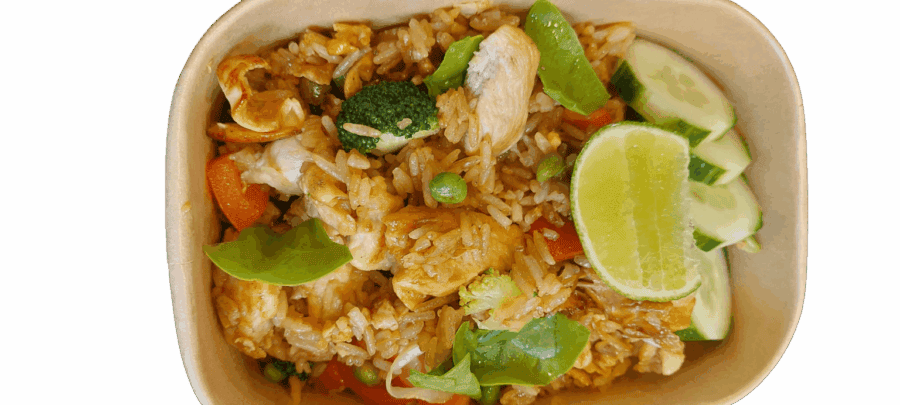 Thai chicken fried rice with vegetables and lime, authentic Asian cuisine.